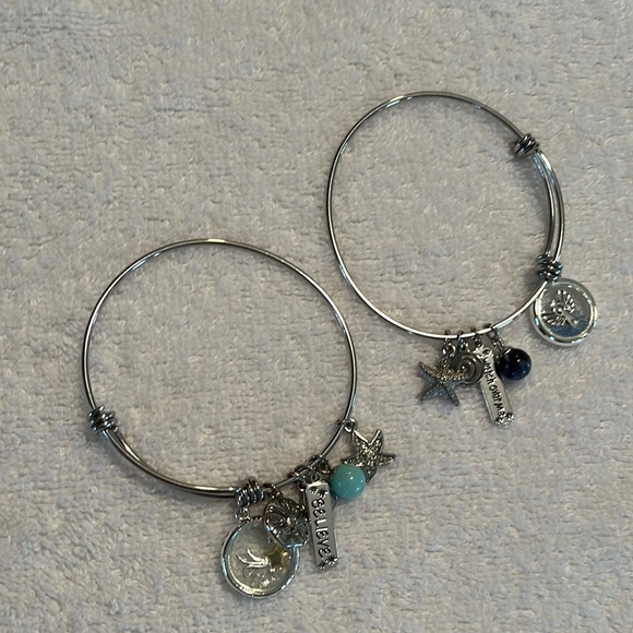 Silver toned bracelets with charms - Picture 1 of 3